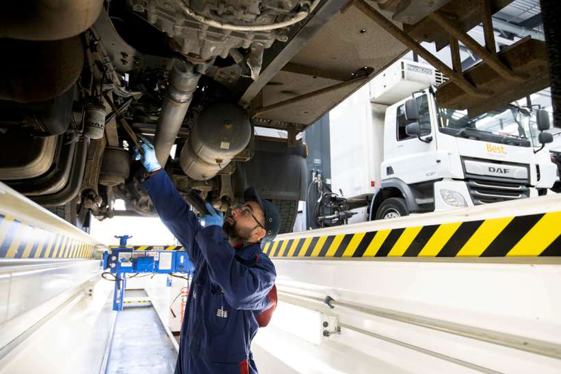 DAF technician under a truck